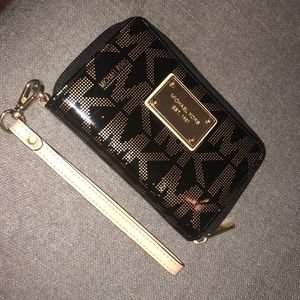 Black and gold authentic Michael Kors wristlet